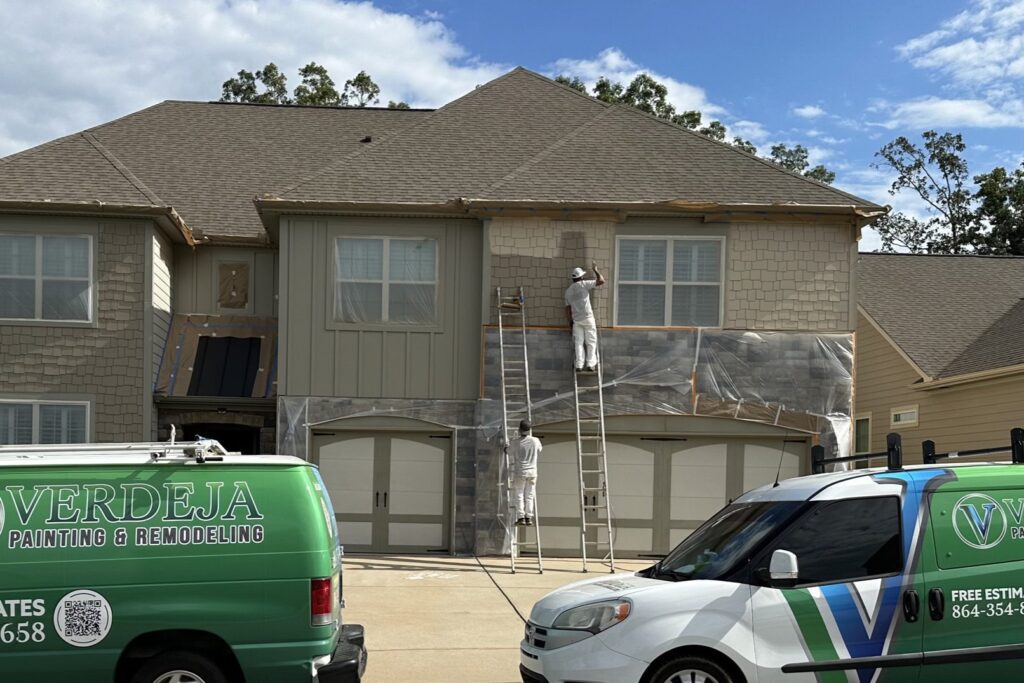 Verdeja Painting & Remodeling crew painting a home exterior in Greenville, SC