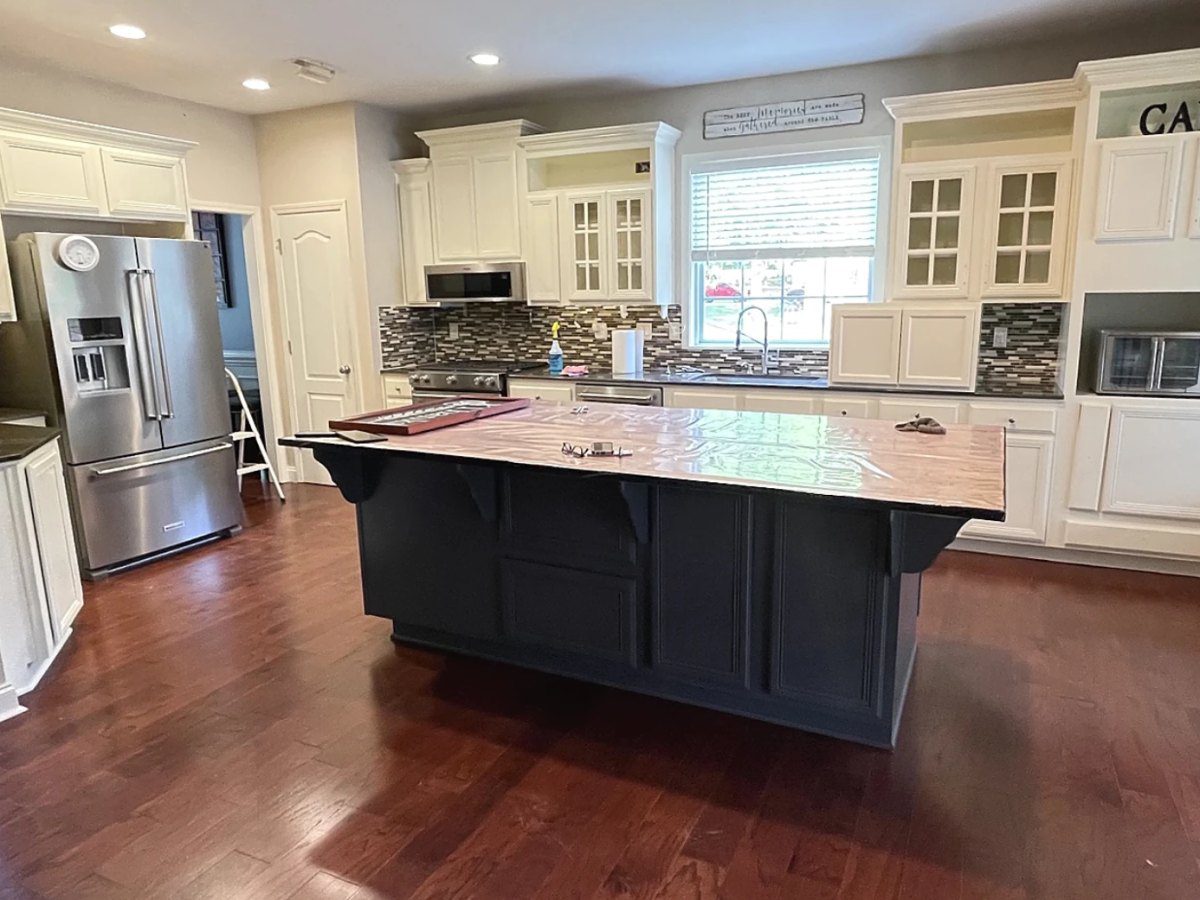 Kitchen cabinets painted cream with a dark painted island – Greenville, SC