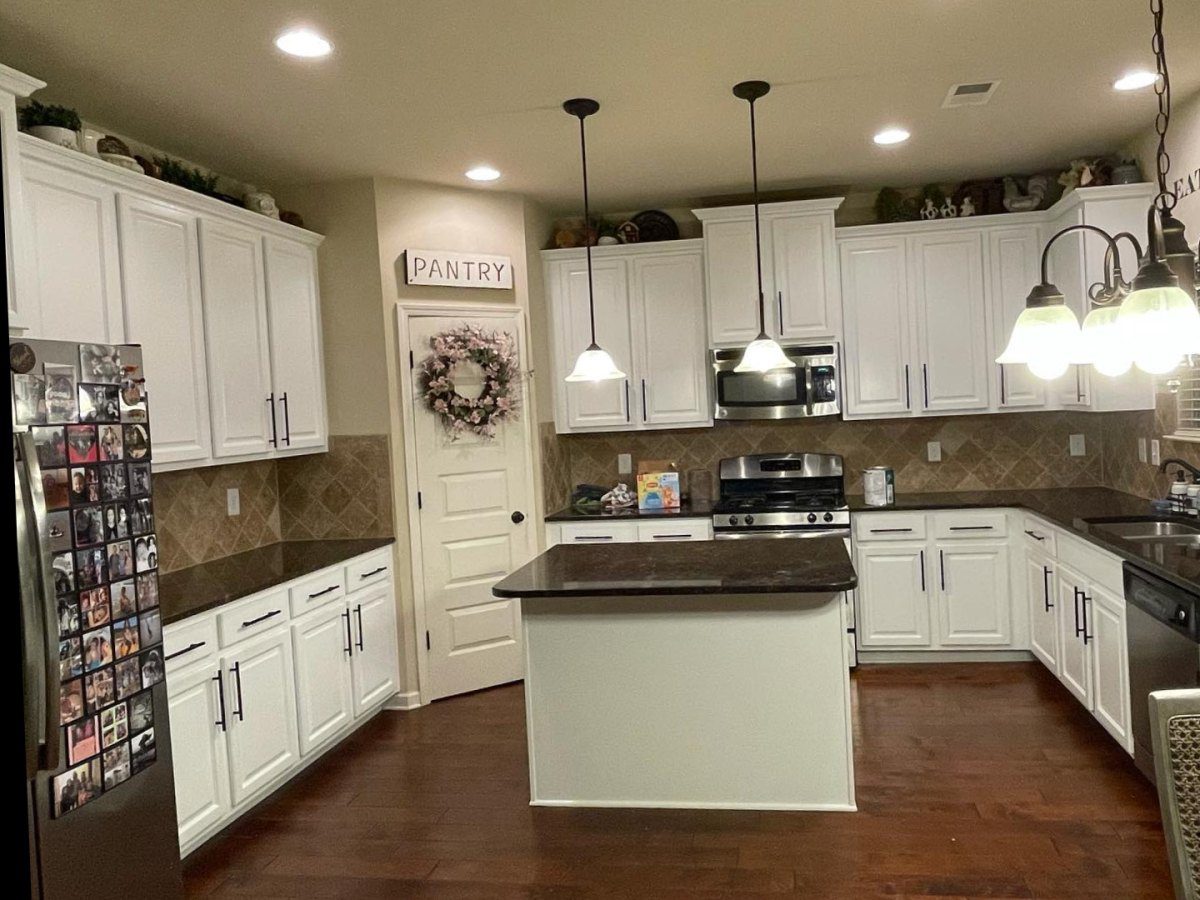 Kitchen cabinets after painting white with black hardware – Greenville, SC