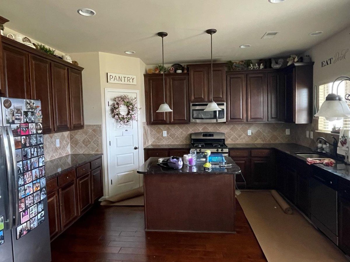 Kitchen cabinets before painting – dark stained cabinets in Greenville, SC