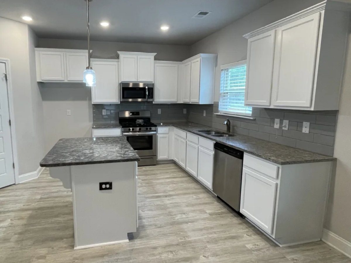 Kitchen cabinets painted white with gray subway tile – Greenville, SC