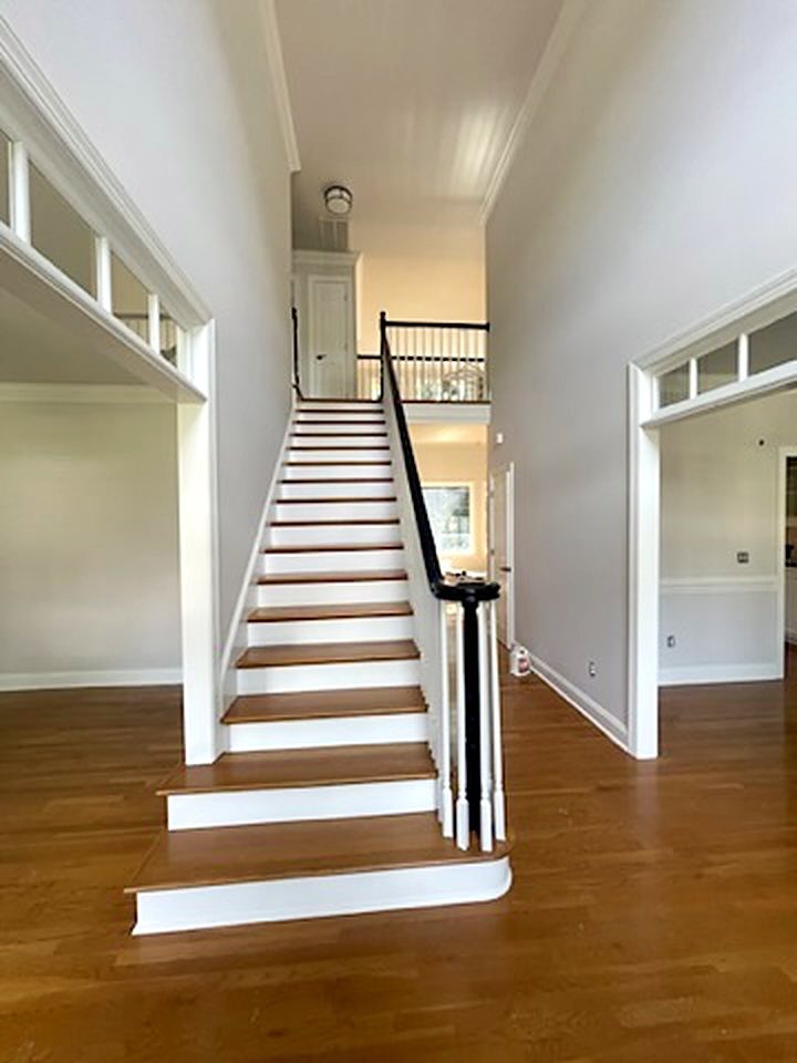 Interior staircase with white painted risers and trim, interior painting Five Forks SC