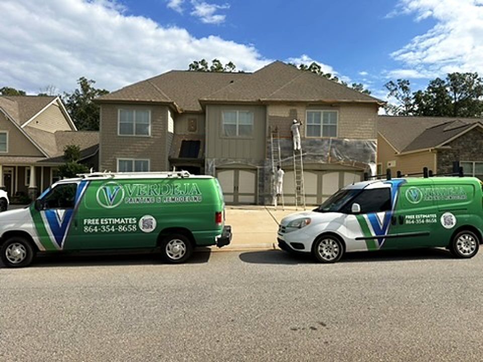 Verdeja Painting crew and vans at an exterior house painting job near Five Forks SC
