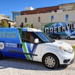 Verdeja Painting & Remodeling van parked by the Greenville SC Main Street mural