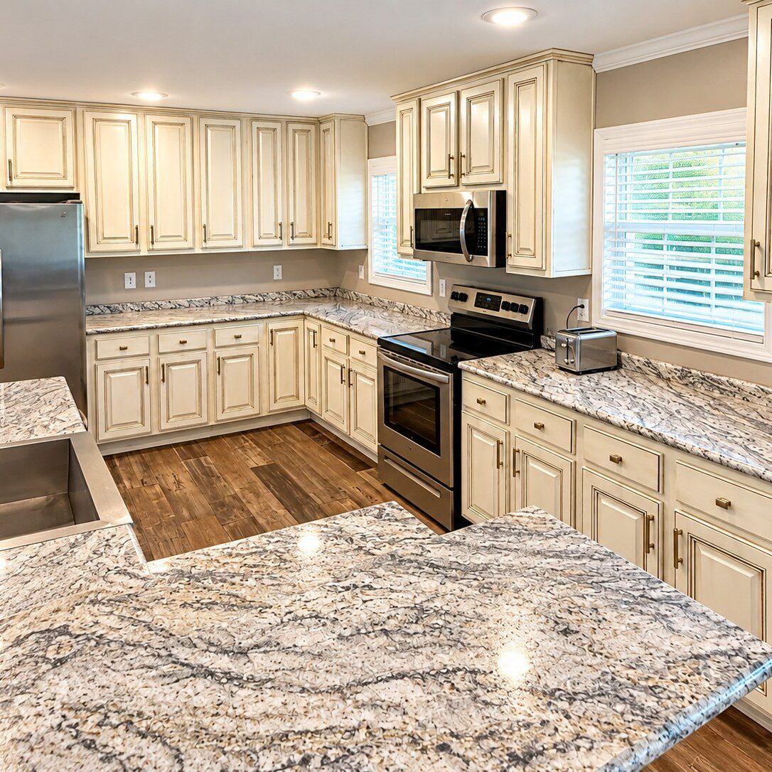Kitchen cabinets painted cream with hand-applied glaze in Greenville, SC